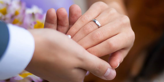 Bride and groom hand in hand