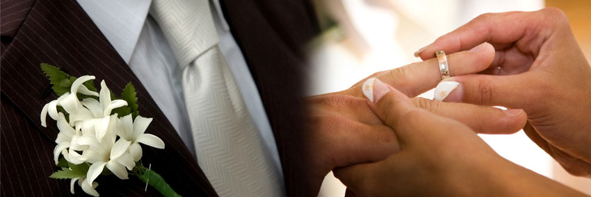 Bride and groom exchange rings during their wedding