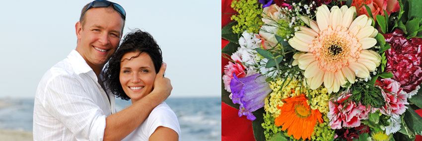 Couple on the beach with wildflower bouquet 